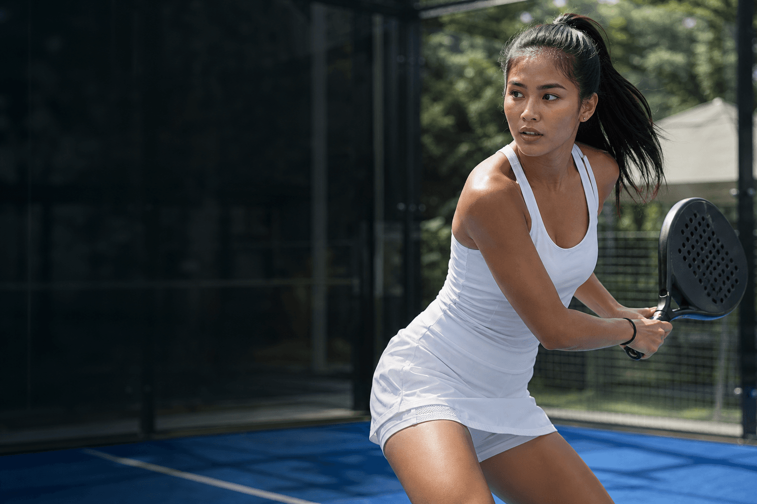 Filipina athlete playing padel on an outdoor court